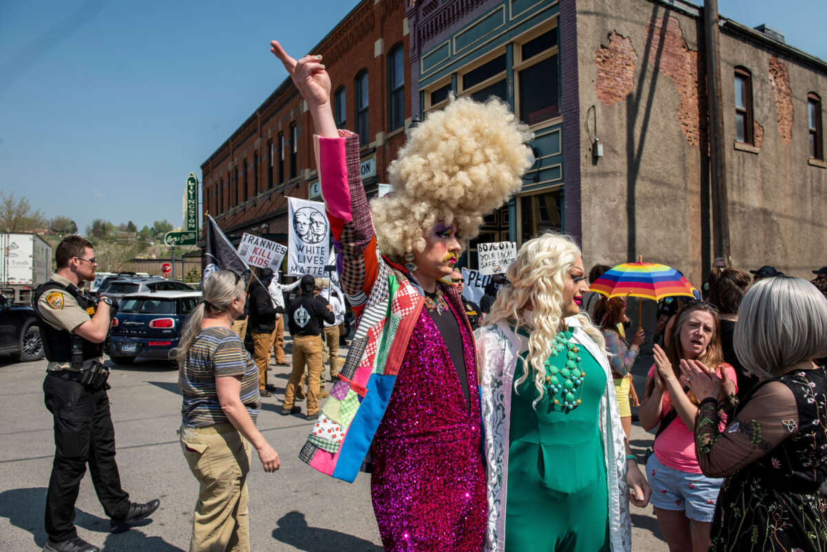 Counter-protestors watch as people representing various right-wing white nationalist groups protest against a Drag Story Hour event outside Wheatgrass Books store on May 20, 2023, in Livingston, Montana.