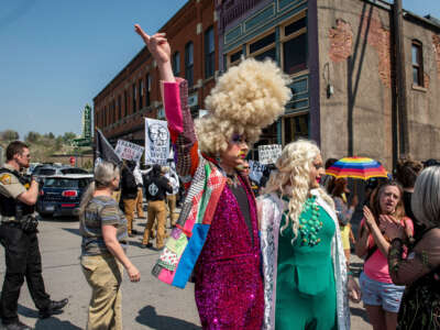Counter-protestors watch as people representing various right-wing white nationalist groups protest against a Drag Story Hour event outside Wheatgrass Books store on May 20, 2023, in Livingston, Montana.