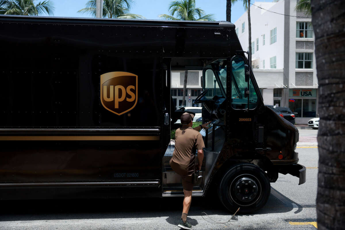 A UPS driver makes a delivery on June 30, 2023, in Miami, Florida.