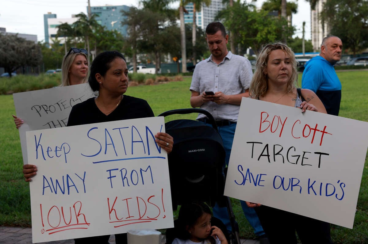 Jennifer Vazquez and Melissa Caicedo protest outside of a Target store on June 1, 2023 in Miami, Florida.