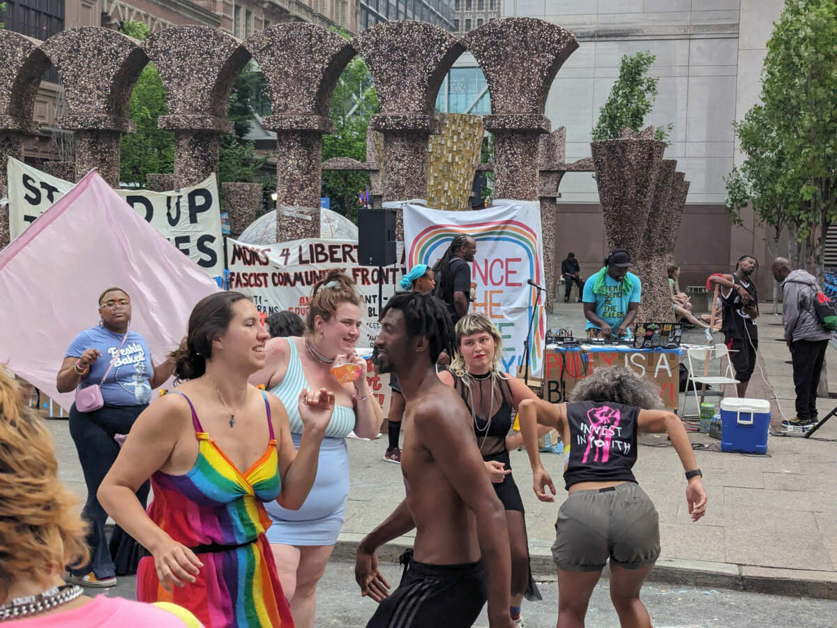 Revelers "Dance the Hate Away" during the Moms 4 Liberty protest on July 1, 2023
