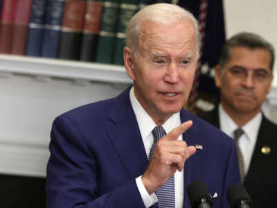 President Joe Biden delivers remarks as Secretary of Health and Human Services Xavier Becerra listens during an event at the Roosevelt Room of the White House on July 8, 2022, in Washington, D.C.