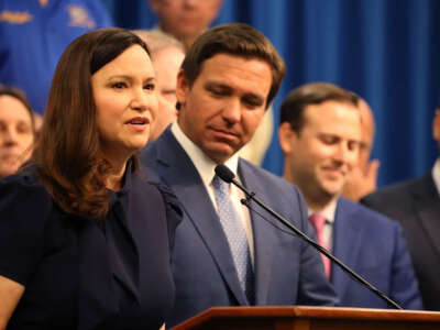 Florida Attorney General Ashley Moody is pictured at a 2021 press conference with Gov. Ron DeSantis.