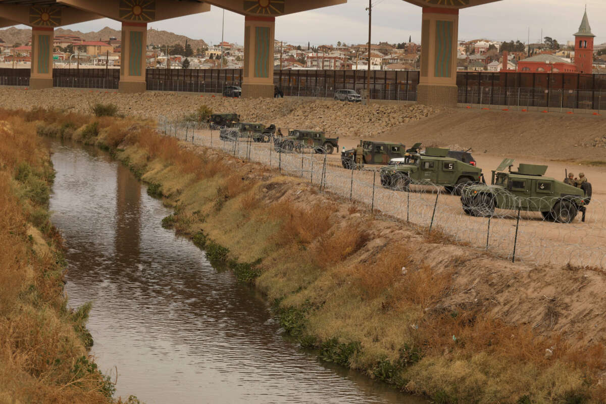 National Guard agents monitor the banks of the Rio Grande on the border between El Paso, Texas, United States, and Ciudad Juarez, Chihuahua state, Mexico, on December 28, 2022.