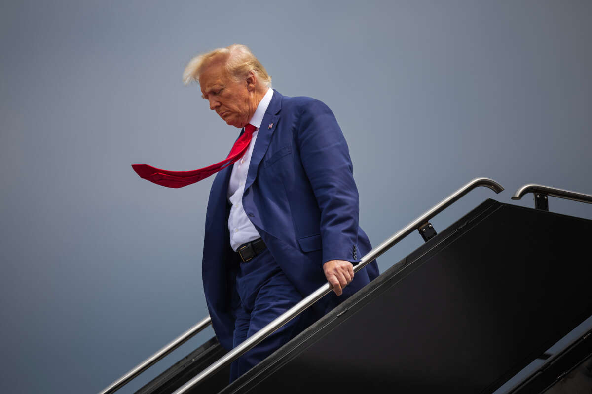 Former president Donald Trump arrives at Ronald Reagan Washington National Airport in Arlington, Virginia. on August 3, 2023, before appearing at E. Barrett Prettyman United States Court House.
