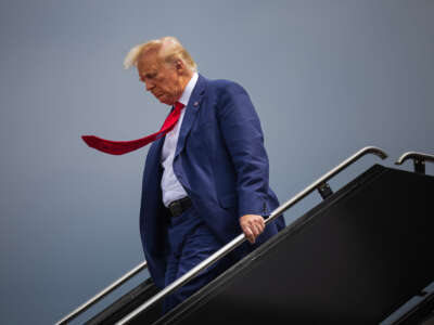 Former president Donald Trump arrives at Ronald Reagan Washington National Airport in Arlington, Virginia. on August 3, 2023, before appearing at E. Barrett Prettyman United States Court House.