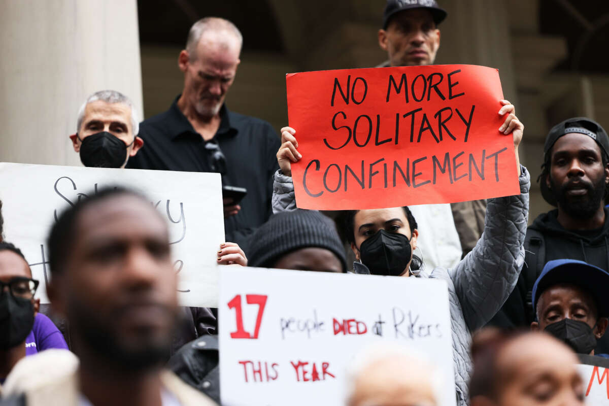 People gather for a rally to protest the 17th death on Rikers Island at City Hall on October 25, 2022, in New York City.
