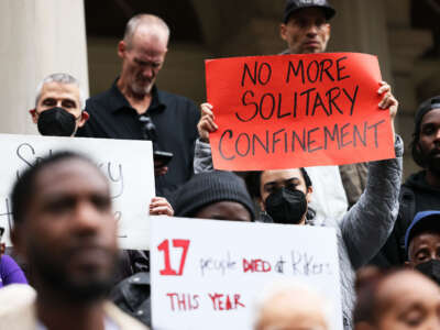 People gather for a rally to protest the 17th death on Rikers Island at City Hall on October 25, 2022, in New York City.