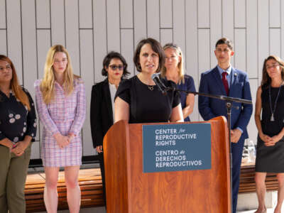 Center for Reproductive Rights attorney Molly Duane speaks during a press conference outside the Travis County Courthouse in Austin, Texas, on July 20, 2023.