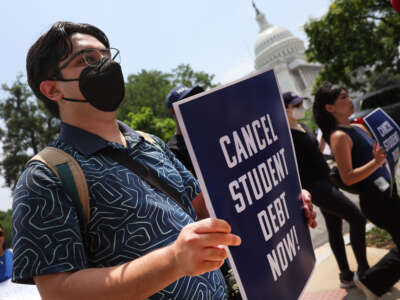 Student debt relief activists participate in a rally as they march from the U.S. Supreme Court to the White House on June 30, 2023, in Washington, D.C.