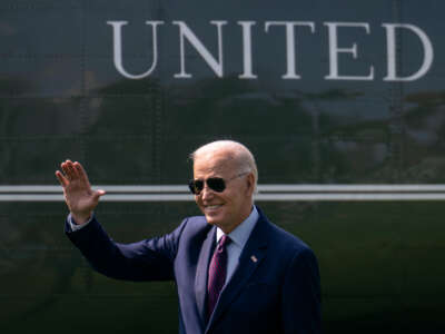 President Joe Biden waves toward visitors watching the departure as he walks to Marine One on the South Lawn of the White House July 28, 2023, in Washington, D.C.