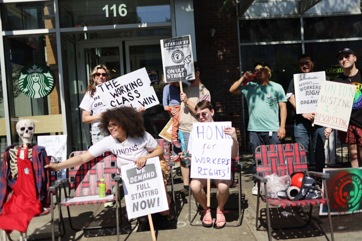 People picket in front of a Starbucks store in the Greektown neighborhood of Chicago, Illinois, on June 24, 2023.
