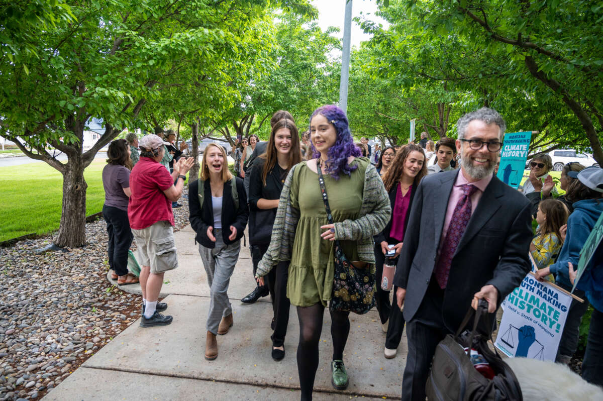 Youth plaintiffs are greeted by supporters as they arrive for the nation's first youth climate change trial at Montana's First Judicial District Court on June 12, 2023, in Helena, Montana.