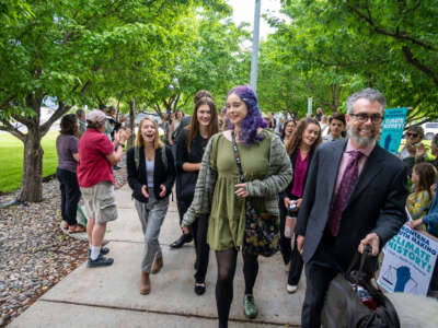 Youth plaintiffs are greeted by supporters as they arrive for the nation's first youth climate change trial at Montana's First Judicial District Court on June 12, 2023, in Helena, Montana.