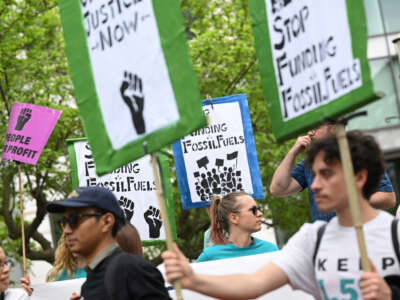 Climate activists protest outside the World Bank headquarters during the World Bank Group and the International Monetary Fund Spring Meetings, calling on the World Bank to stop financing fossil fuels, in Washington, D.C., on April 14, 2023.