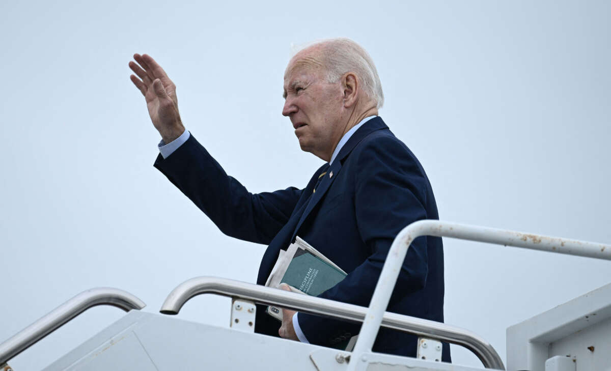 President Joe Biden waves as he departs from Delaware Air National Guard Base in New Castle, Delaware, on August 7, 2023.