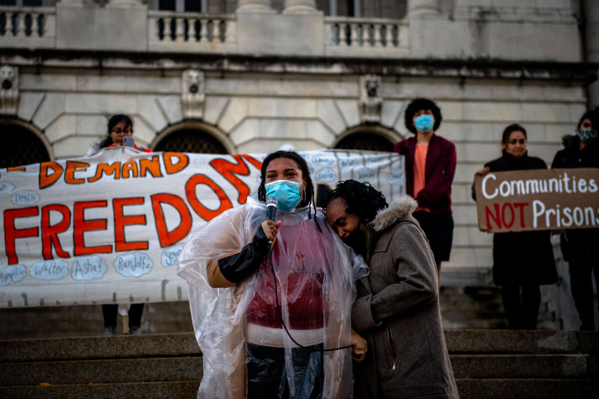 Laura Julney speaks outside of Bergen County Justice Center after marching from Bergen County Jail, where ICE detainees had been held, in Hackensack, New Jersey, on November 13, 2021.