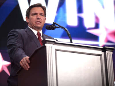 Florida Gov. Ron DeSantis speaks with attendees at a rally at Arizona Financial Theatre in Phoenix, Arizona, on August 14, 2022.