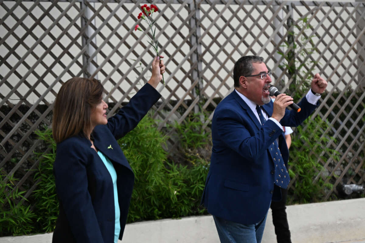 Guatemalan president-elect for the Movimiento Semilla party, Bernardo Arevalo (R), speaks to supporters next to his running mate, Karin Herrera, during a demonstration outside the Attorney General's Office headquarters in Guatemala City, on July 13, 2023.