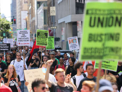 Pro-union demonstrators march on Fifth Avenue on September 5, 2022, in New York City.
