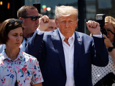 Former President Donald Trump acknowledges supporters as he visits the Iowa State Fair on August 12, 2023, in Des Moines, Iowa.