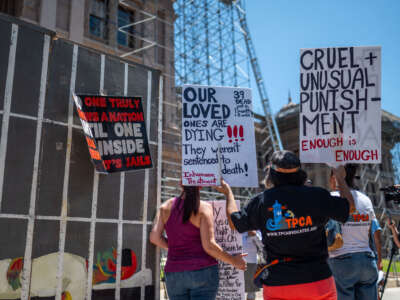 Protesters gather outside the Texas State Capitol building in Austin, Texas, on July 18, 2023. Activists visited the capitol to discuss the need for air conditioning in Texas state prisons, citing the harsh conditions and multiple deaths related to the heat and lack of relief from it.