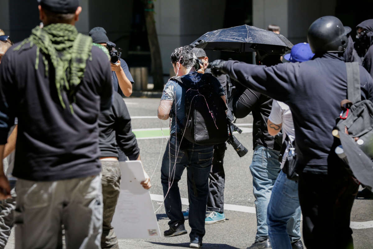 Andy Ngo is seen covered in an unknown substance on June 29, 2019, in Portland, Oregon.