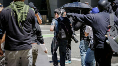 Andy Ngo is seen covered in an unknown substance on June 29, 2019, in Portland, Oregon.