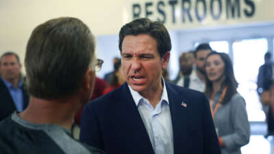 Republican presidential candidate Florida Gov. Ron DeSantis greets guests at Ashley's BBQ Bash on August 6, 2023, in Cedar Rapids, Iowa.