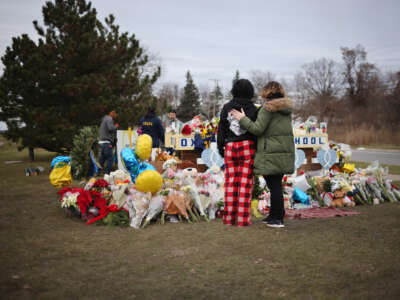 A memorial outside of Oxford High School continues to grow on December 3, 2021, in Oxford, Michigan.