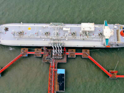 The LNG tanker Spirit of Hela is seen transmitting liquified natural gas (LNG) from Papua New Guinea at a reception terminal at Yangkou Port in Rudong County in China's Jiangsu province on July 23, 2020.