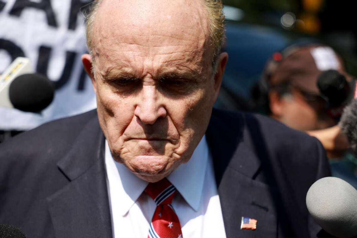 Rudy Giuliani speaks to the media after leaving the Fulton County jail on August 23, 2023, in Atlanta, Georgia.
