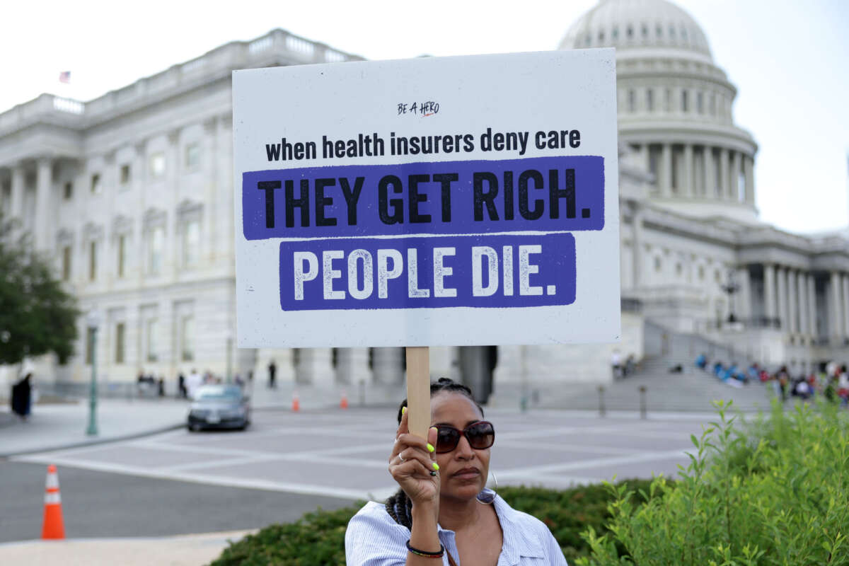 An advocate holds a sign during a news conference on Medicare Advantage plans in front of the U.S. Capitol on July 25, 2023, in Washington, D.C.
