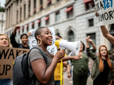 Activists doing a demonstration outdoors