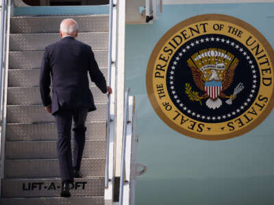 U.S. President Joe Biden boards Air Force One to leave Japan after his South Korea trip at Osan Air Force Base on May 22, 2022, in Pyeongtaek, South Korea.