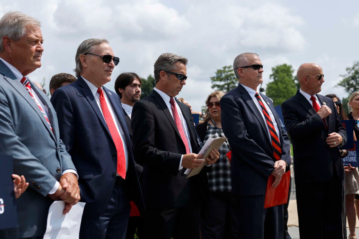 House Freedom Caucus members listen during a news conference on the progress of the Fiscal Year Appropriation Legislation outside the U.S. Capitol Building on July 25, 2023, in Washington, D.C.