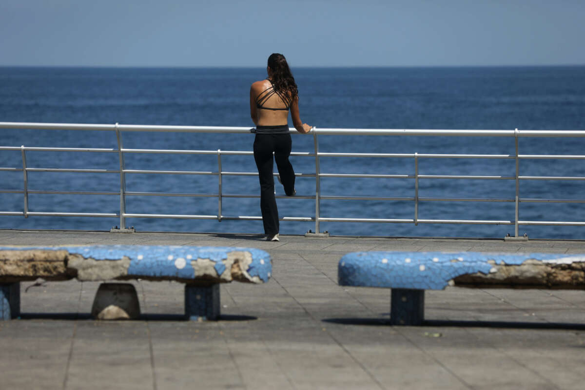 A person enjoys the sea side on August 4, 2023, in Beirut, Lebanon.