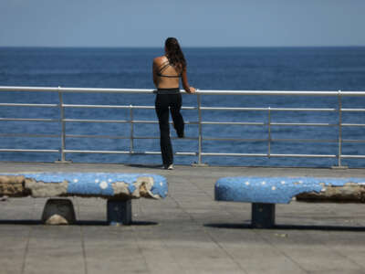 A person enjoys the sea side on August 4, 2023, in Beirut, Lebanon.