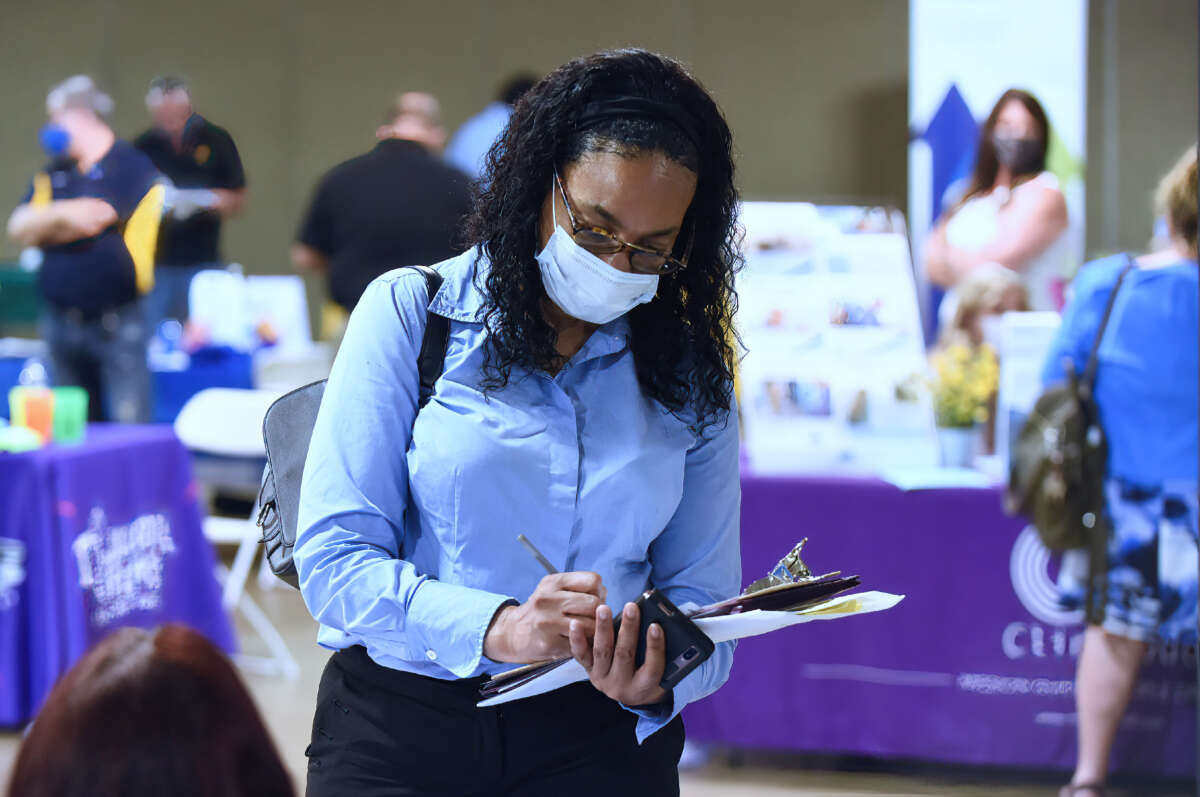 A woman seeking employment attends the 25th annual Central Florida Employment Council Job Fair at the Central Florida Fairgrounds on May 12, 2021.