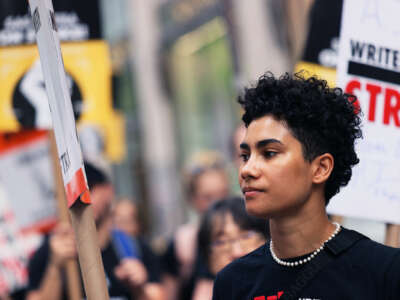 A young person participates in a strike