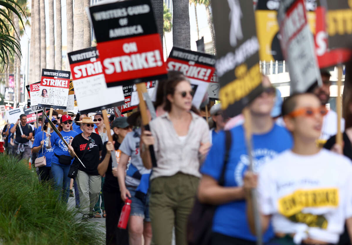 Striking WGA (Writers Guild of America) members picket with striking SAG-AFTRA members outside Netflix studios on September 22, 2023, in Los Angeles, California.