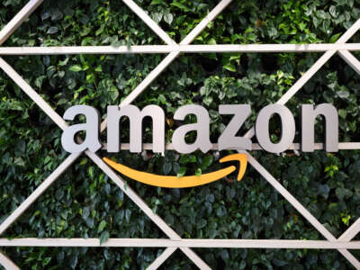 Amazon's logo hangs in the entrance area at the online retailer's research and development site during a press event in Saxony, Dresden, on September 14, 2023.