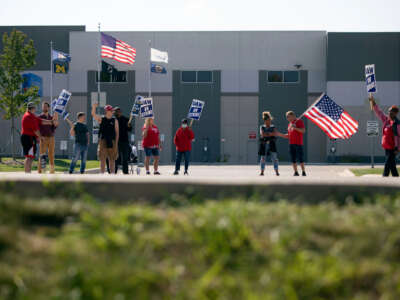 United Auto Workers (UAW) members strike the General Motors Davison Road Processing Center on September 23, 2023, in Burton, Michigan.