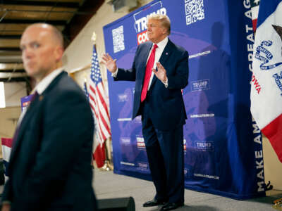 Former president Donald Trump arrives for a commit to caucus rally on September 20, 2023, at the Jackson County Fairgrounds in Maquoketa, Iowa.