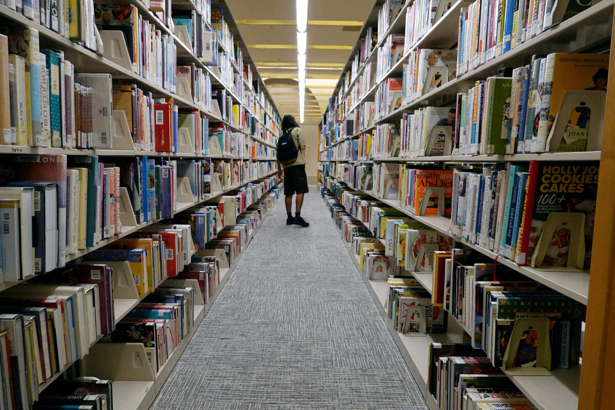 A person looks at books at a Miami-Dade Public Library on July 19, 2023, in Miami, Florida.