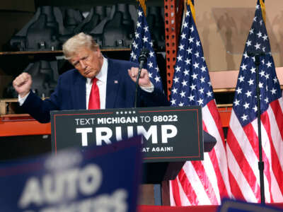 Former President Donald Trump speaks at a campaign rally at Drake Enterprises, an automotive parts manufacturer, on September 27, 2023, in Clinton Township, Michigan.