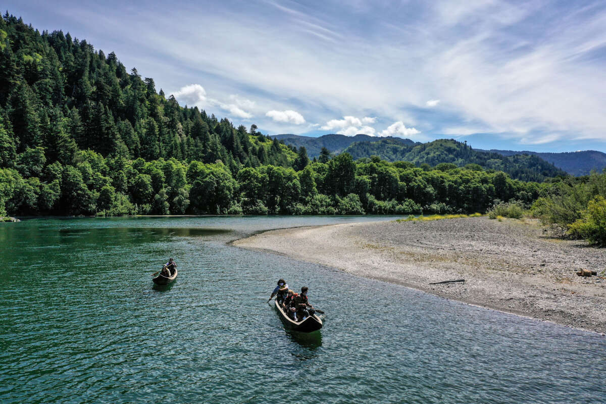 Yurok guides paddle tourists along the Klamath River in traditional canoes hand crafted from Redwood trees. Tribes in rural or remote areas like Yurok face drastic impacts from federal government shutdowns.