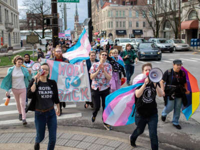 People gather for a rally organized by LGBTQ youth and adults in opposition to Senate Bill 150 and also to celebrate Trans Day of Visibility in Lexington, Kentucky, on March 31, 2022.