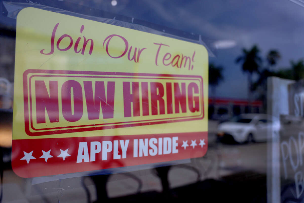 A "Now Hiring" sign posted in the window of a restaurant looking to hire workers on May 5, 2023 in Miami, Florida.