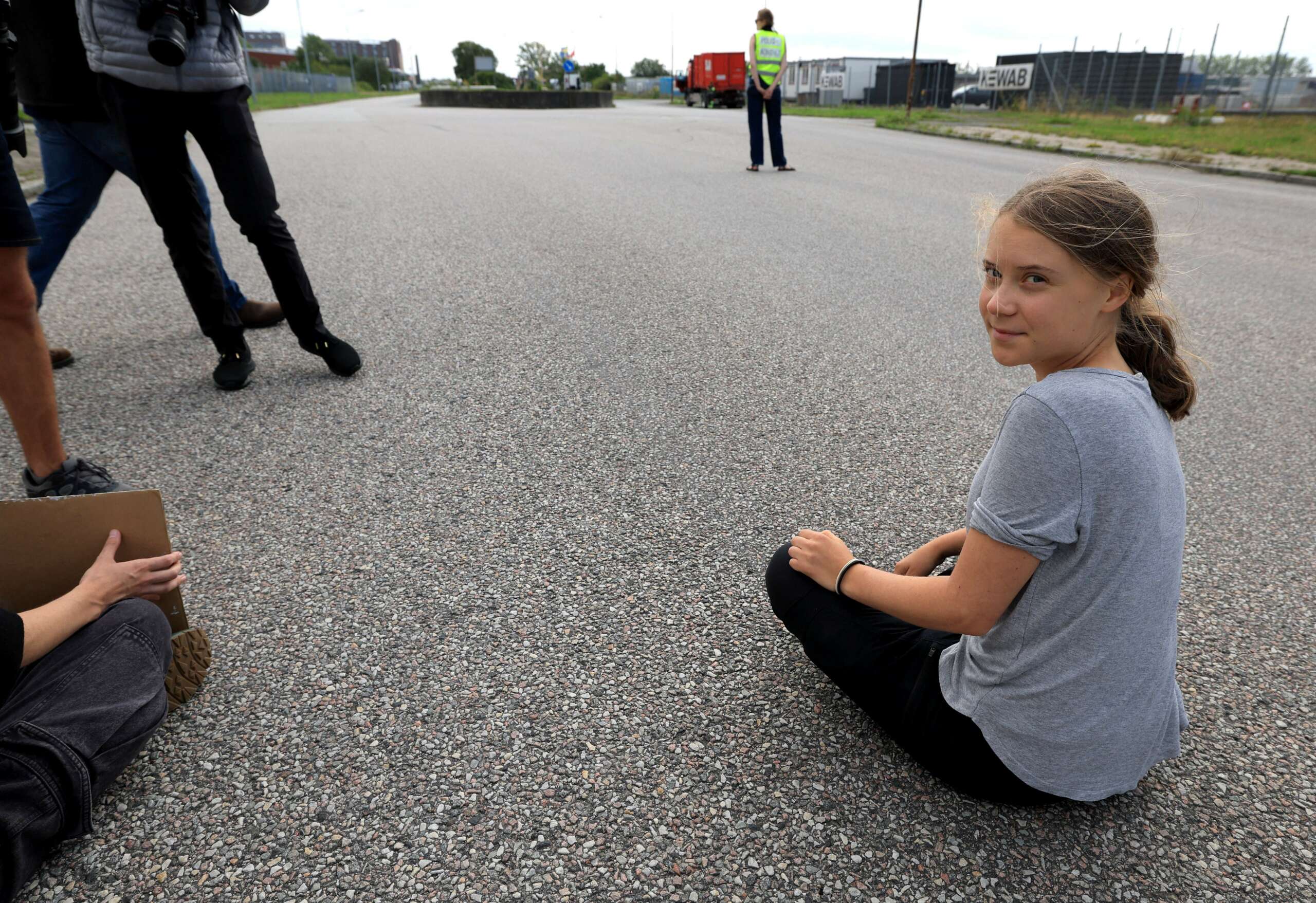 Swedish climate activist Greta Thunberg protests by blocking the entrance to Oljehamnen neighborhood in Malmö, Sweden, on July 24, 2023.